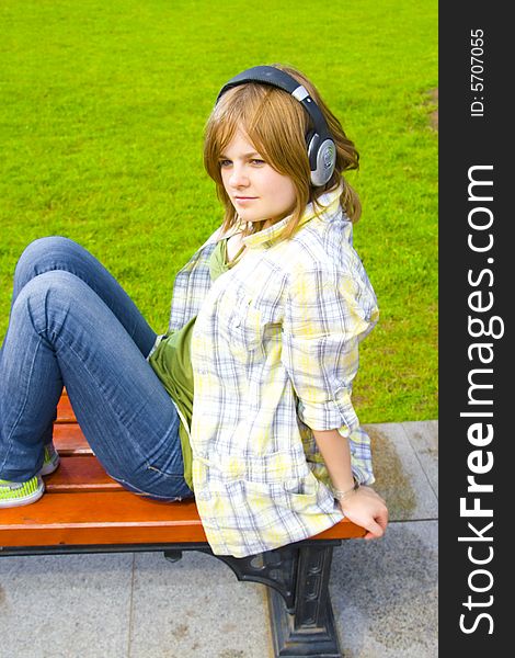 The young attractive girl with headphones. The young attractive girl with headphones