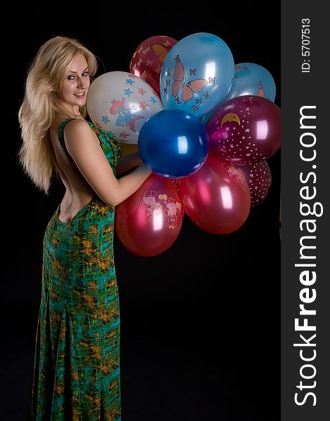 Girl with ballons on black background