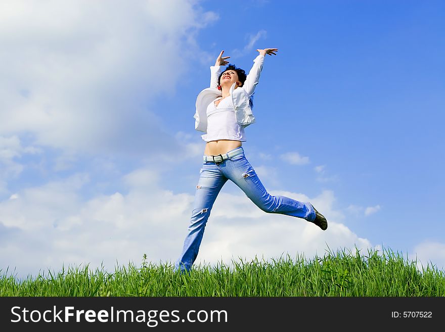 Happy young woman is jumping