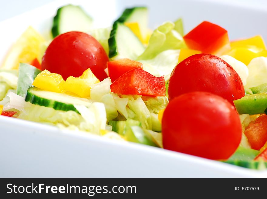 Shot of a side salad in a white dish. Shot of a side salad in a white dish