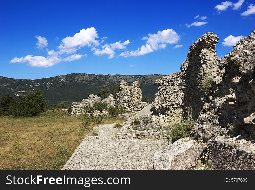 Some ruins in mountains landscape with blue sky. Some ruins in mountains landscape with blue sky