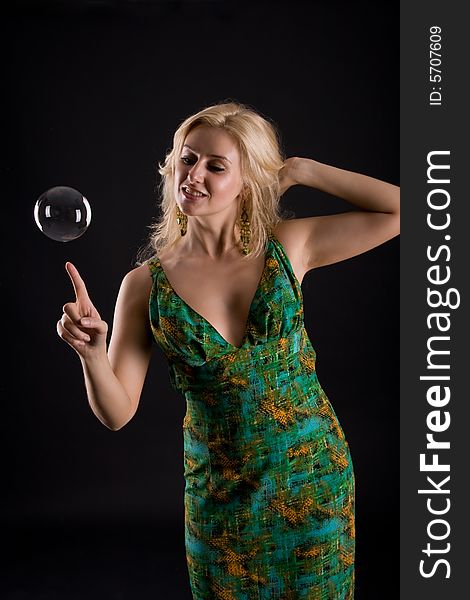 Girl with bubble on black background
