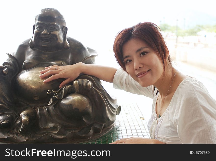 Taken in Hongkong at the beach. On the picture is also the buddha, who brings people happiness. Taken in Hongkong at the beach. On the picture is also the buddha, who brings people happiness.