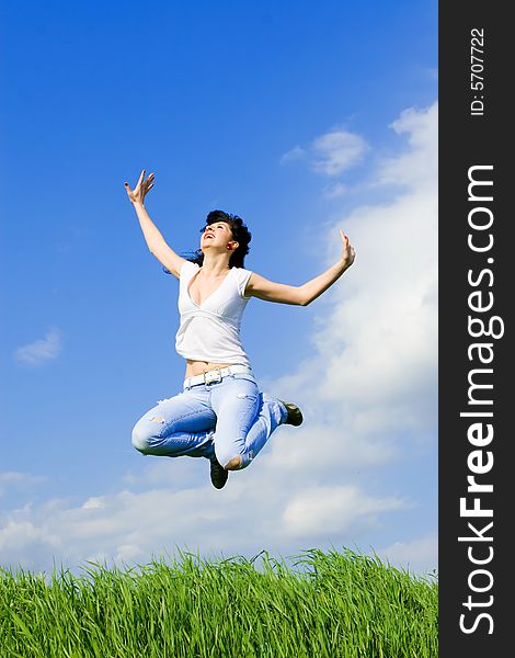 Happy young woman is jumping