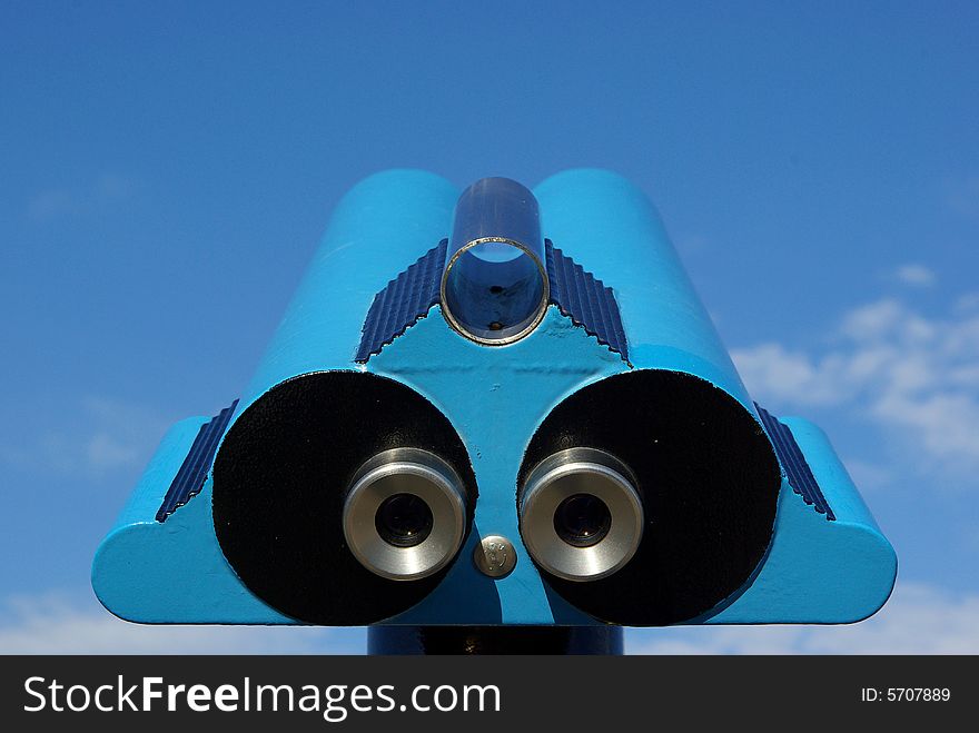 Binoculars for observation over a blue sky. Binoculars for observation over a blue sky.