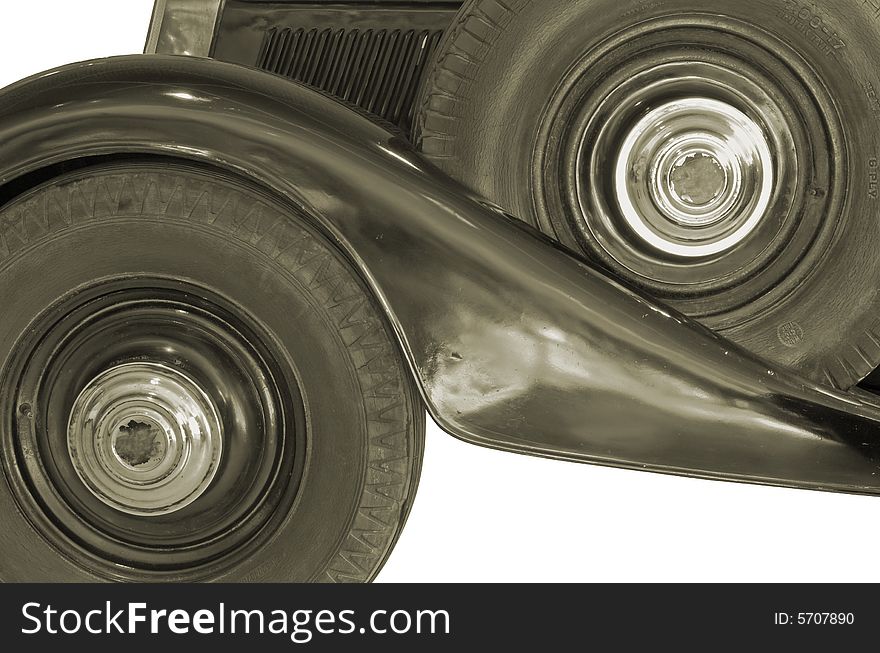 The wheels of ancient car isolated over white with clipping path. The wheels of ancient car isolated over white with clipping path.