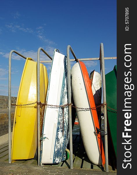 Small boats vertically stored in a seaport. Small boats vertically stored in a seaport.