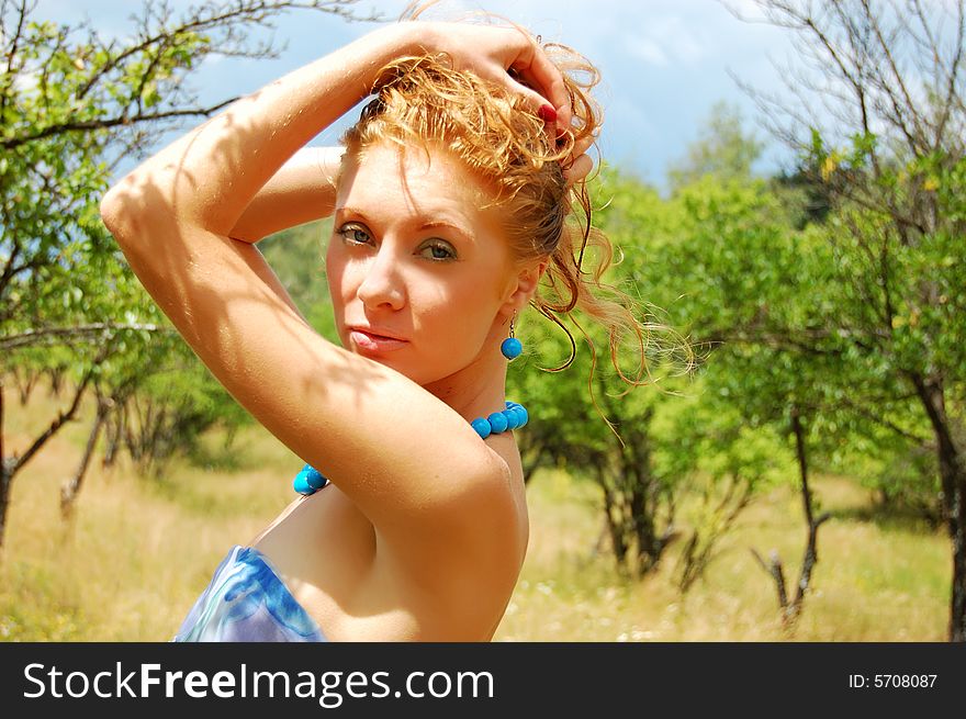 Sensual redhead girl with diadem on nature background. Sensual redhead girl with diadem on nature background