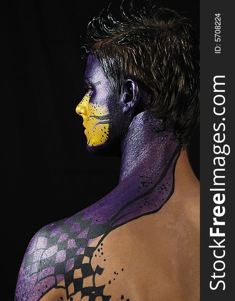 Portrait of young model wearing artistic bodypaint drawing