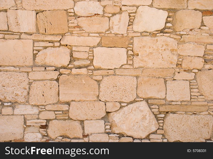 Stone wall from rough sandstone with cement