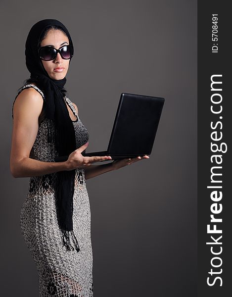 Portrait of young fashion female holding laptop. Portrait of young fashion female holding laptop