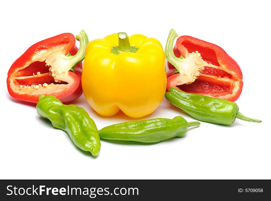 Fresh red sliced, yellow, green peppers isolated over white background. Fresh red sliced, yellow, green peppers isolated over white background