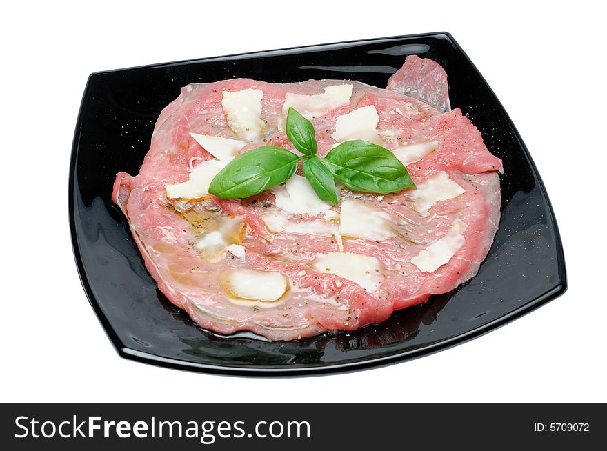 Fresh meat seasoned with grana cheese and oil over a white background. Fresh meat seasoned with grana cheese and oil over a white background