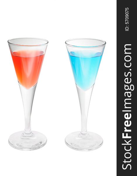 Two red and blue cocktail glasses isolated over white background. Two red and blue cocktail glasses isolated over white background