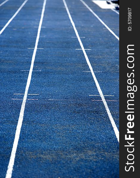A blue running track at a hight school