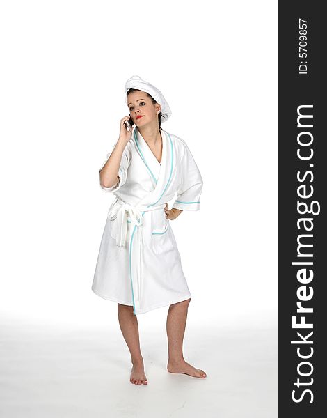 Teen in towel and robe like at the spa, on phone. Teen in towel and robe like at the spa, on phone