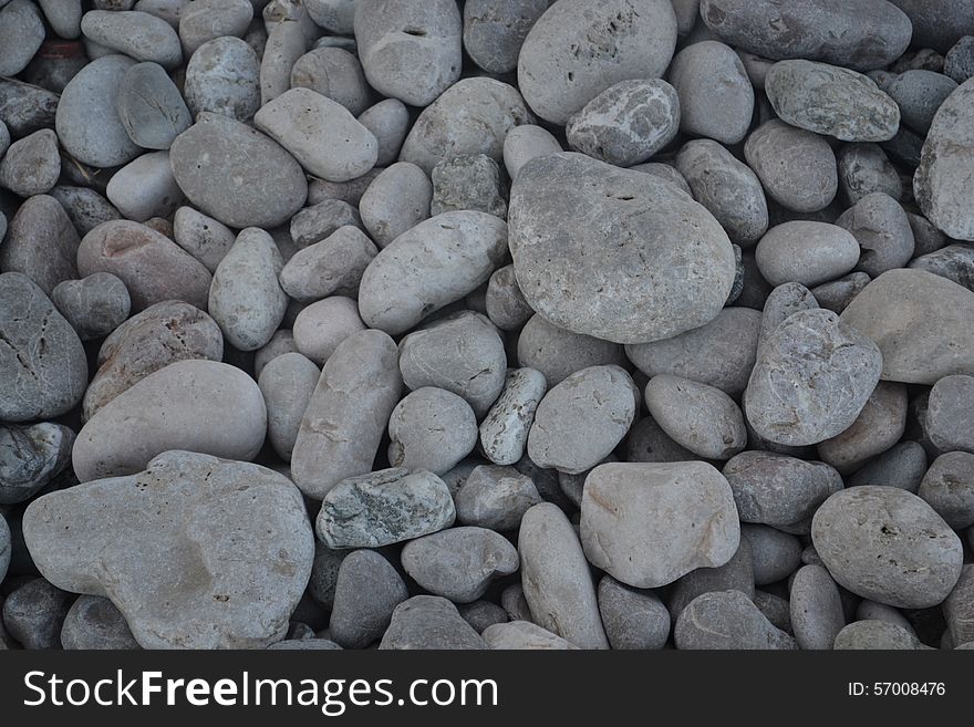 Volcanic pebbles on beach, Taormina, Sicily, Italy