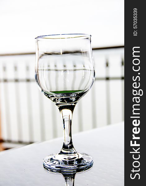 Empty wine glass on table