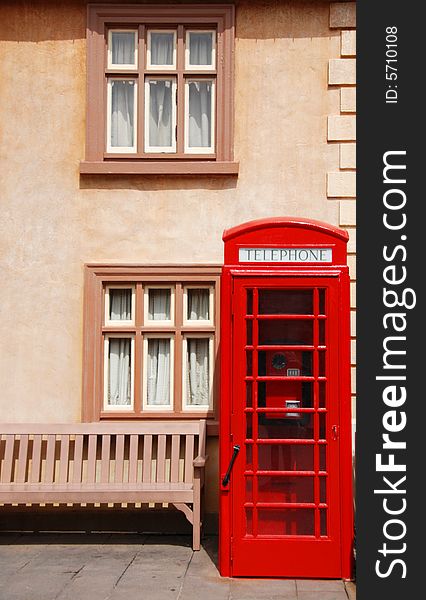 British telephone box in front of a houses
