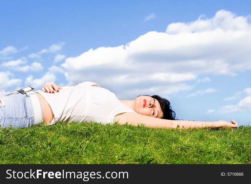 Woman Rest On The Green Grass