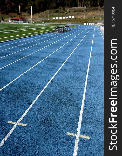 A blue running track at a hight school