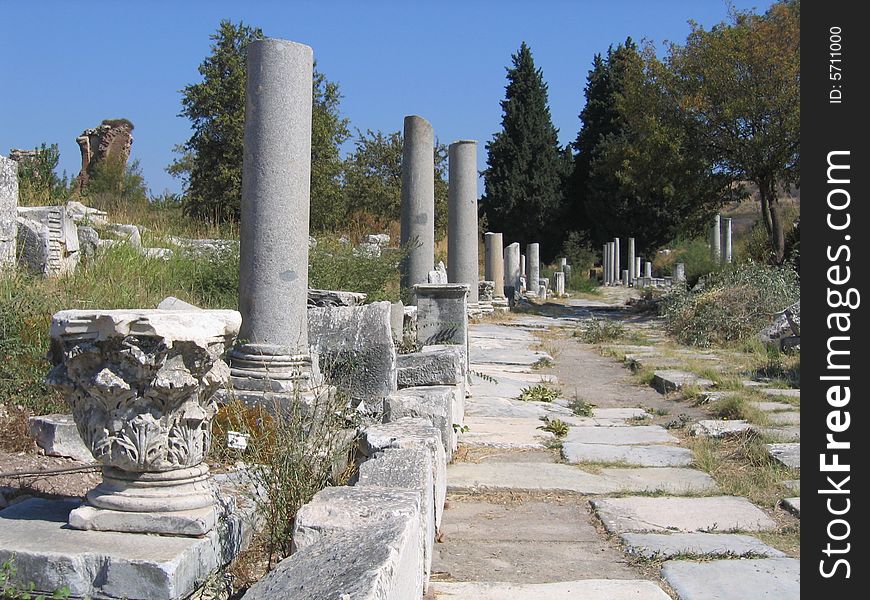 Ancient column lined roadway, in the city of Ephesus. Ancient column lined roadway, in the city of Ephesus.