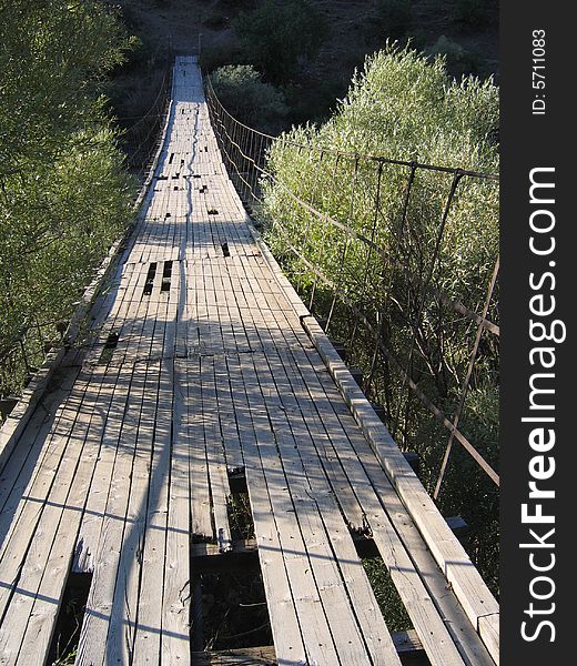 Old, wooden, dilapidated suspension bridge in central Turkey. Old, wooden, dilapidated suspension bridge in central Turkey.