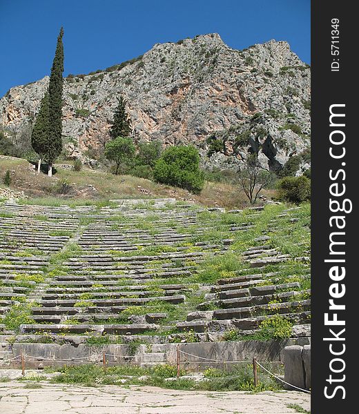 Delphi, Greece - Ancient Amphitheater And Mountain