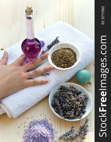 Women hand with lavender on the towel.