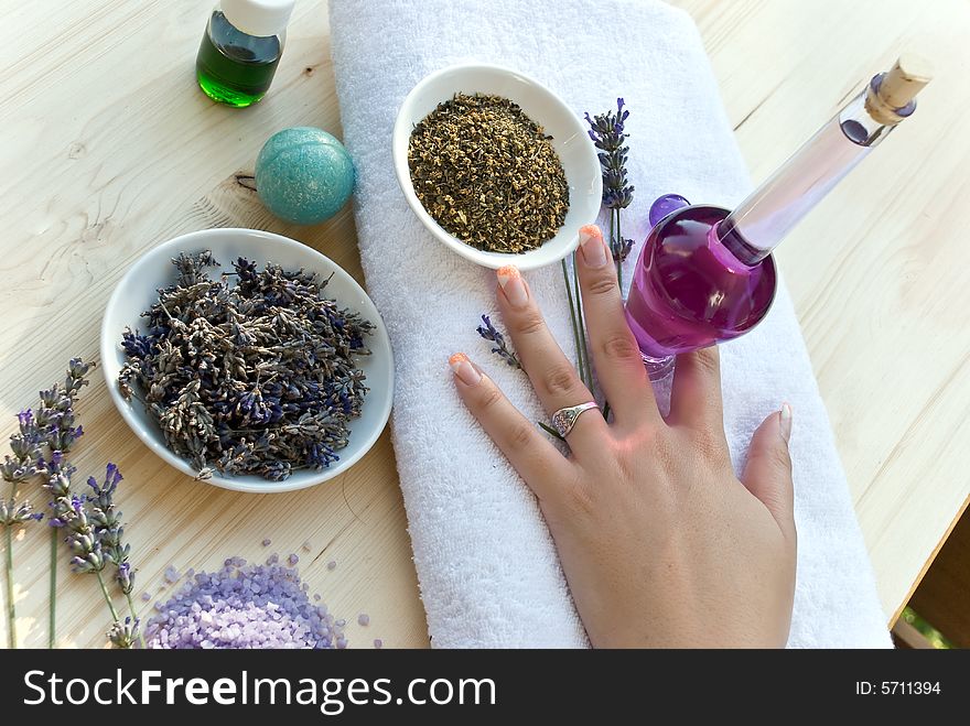 Women hand with lavender on the towel