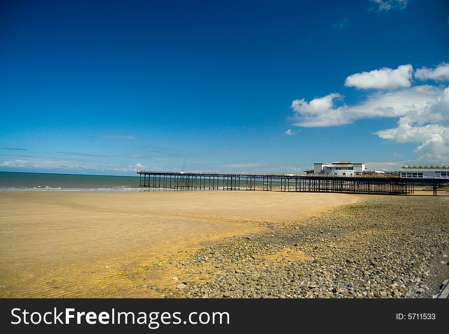 The landscape of the beach and pier at rhos-on-sea in wales. The landscape of the beach and pier at rhos-on-sea in wales