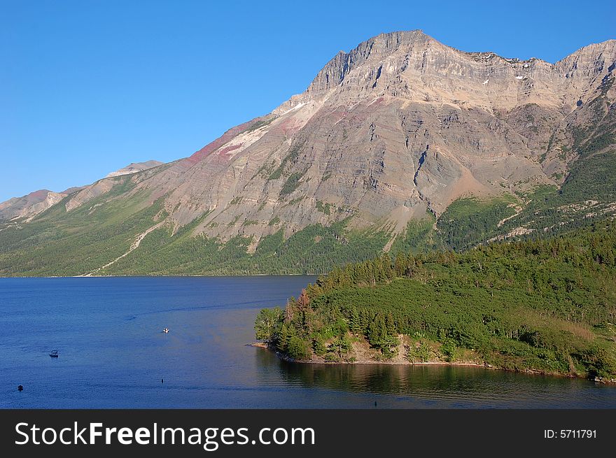 The upper waterton lake and alpine slope, alberta, canada. The upper waterton lake and alpine slope, alberta, canada