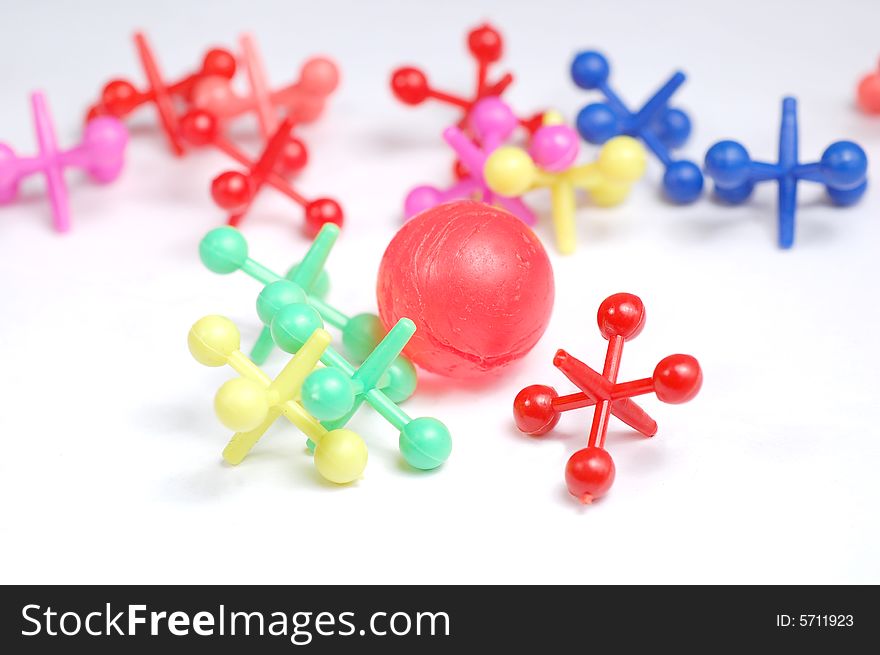 Jacks and ball isolated on a white background