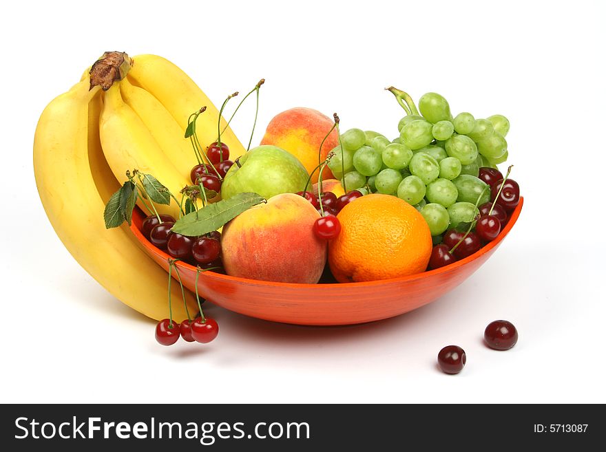 Colorful vase with fruits and berries