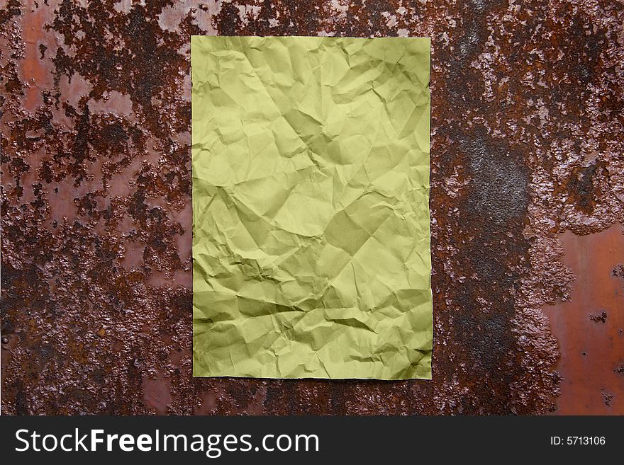 Paper sheet on rusty brown iron surface. Paper sheet on rusty brown iron surface