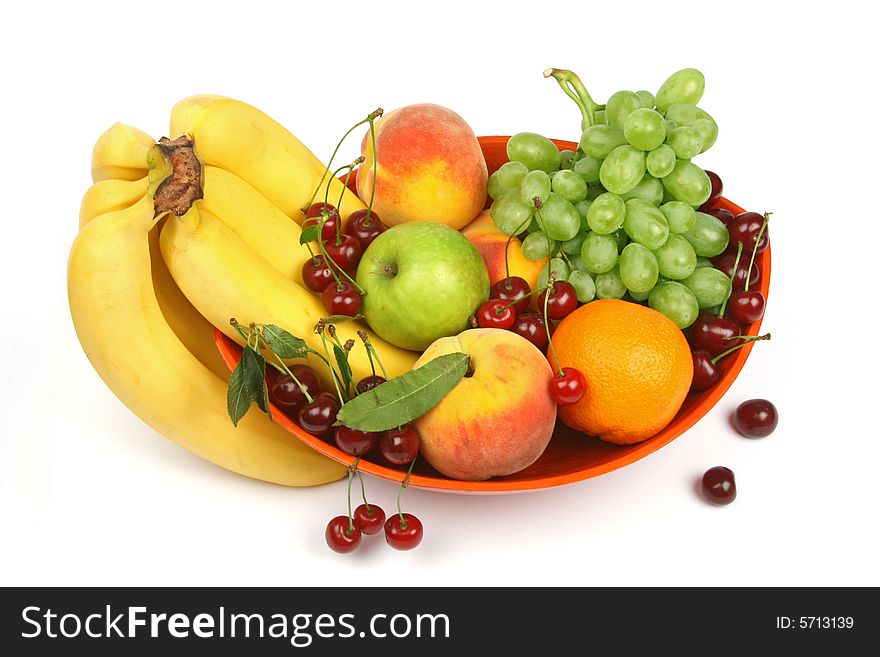 Orange vase with colorful fruits