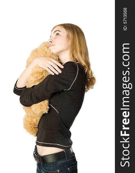 Young girl hugging a Teddy bear, isolated. Young girl hugging a Teddy bear, isolated