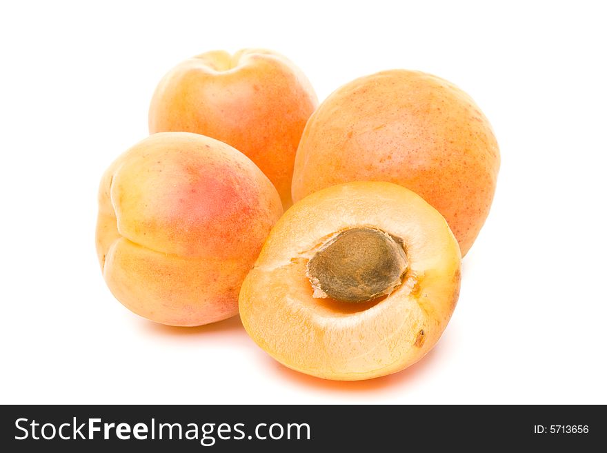 Fresh appetizing apricots on a white background. Fresh appetizing apricots on a white background