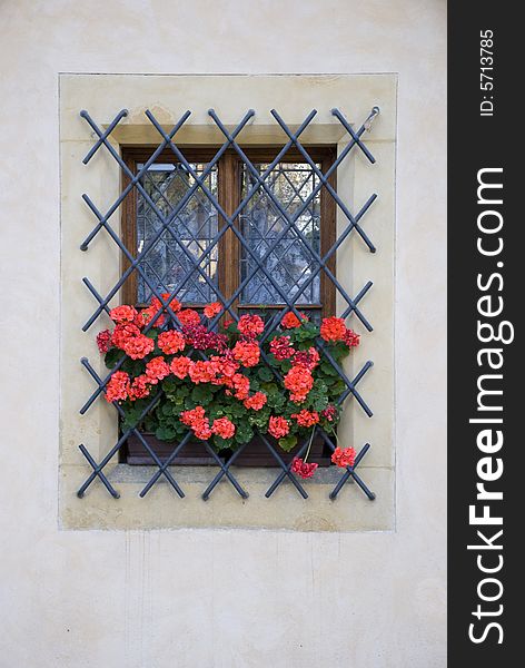 Beautiful Czech window with red odoriferous flowers. Beautiful Czech window with red odoriferous flowers