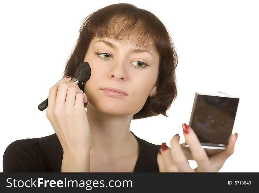 A photo of a young girl make herself up. A photo of a young girl make herself up