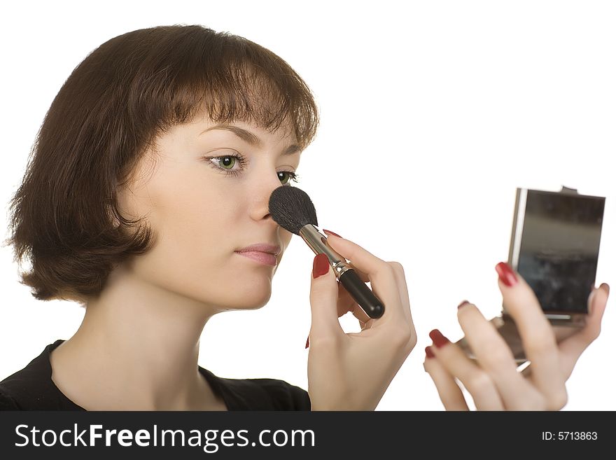 A photo of a young girl make herself up. A photo of a young girl make herself up