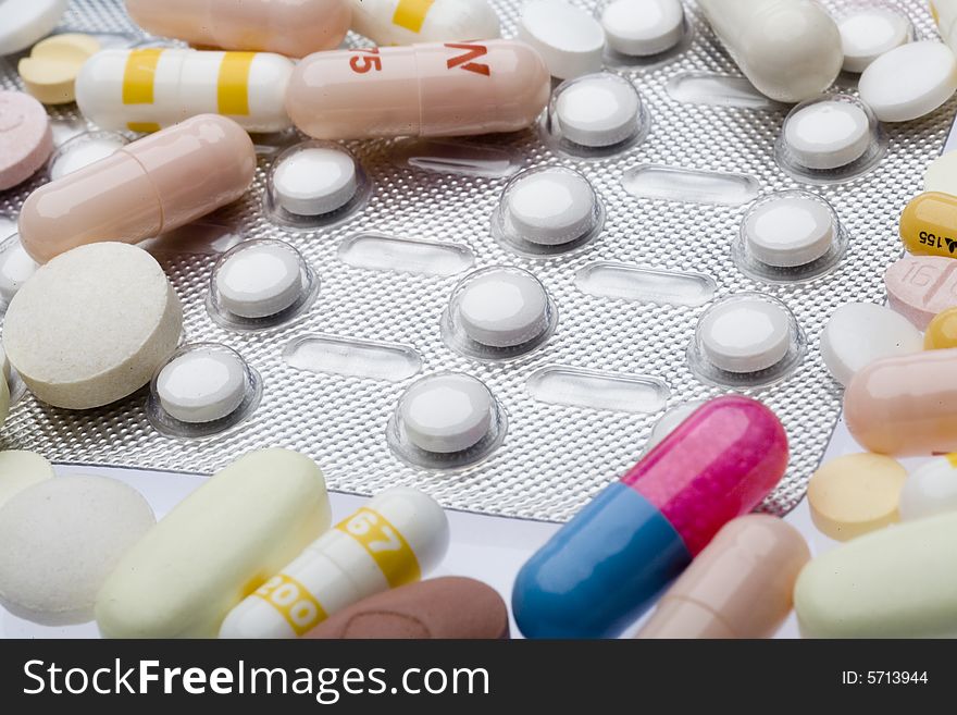 Pills and capsules on white background. Pills and capsules on white background