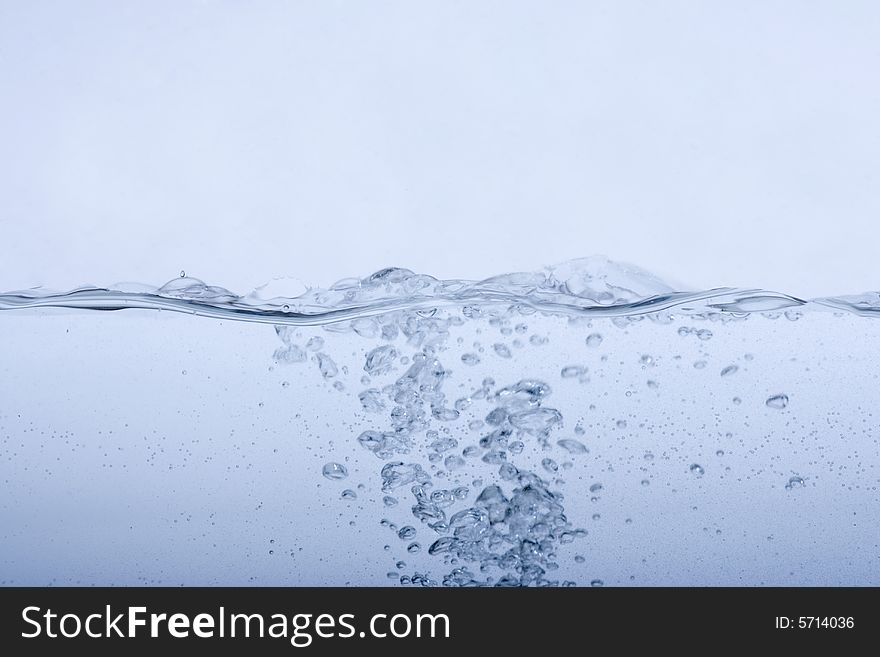 Water splashing and drops on a white background