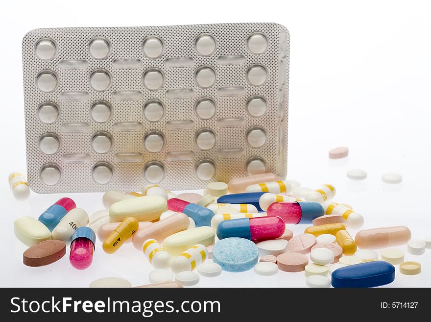 Pills and capsules on white background. Pills and capsules on white background