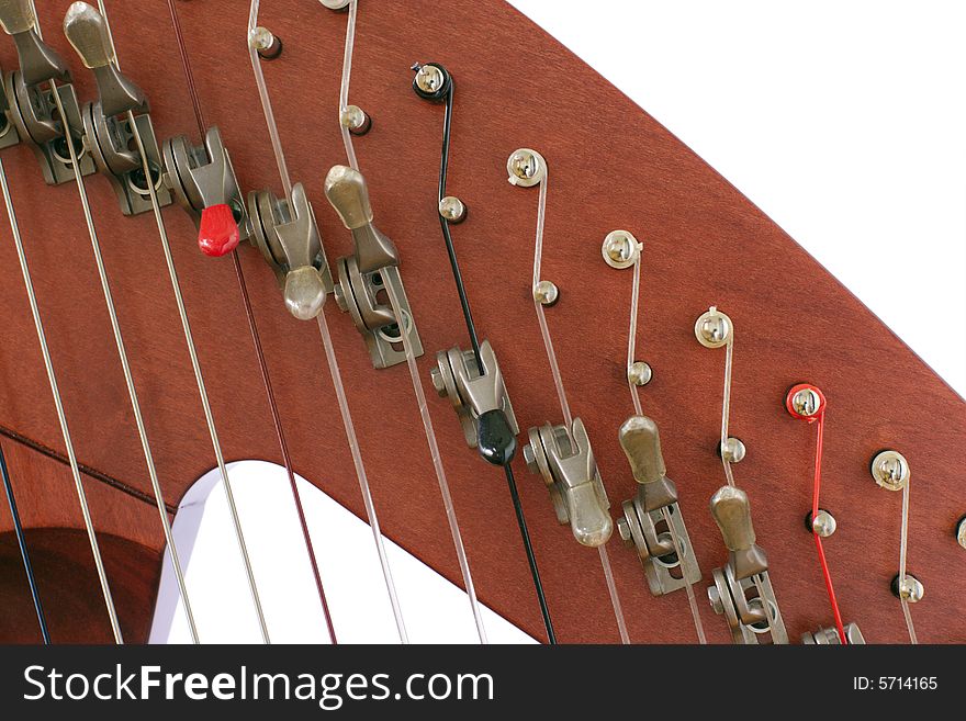 Levers and strings of folk harp close up. Levers and strings of folk harp close up