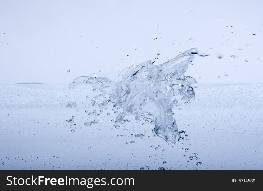 Water splashing and drops on a white background