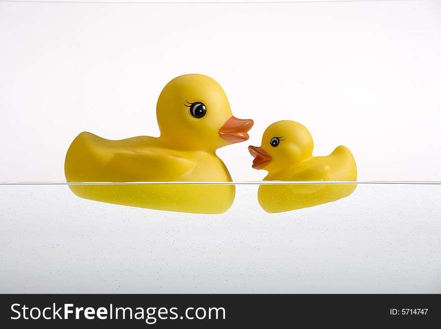 Two yellow rubber duckies, mum and son