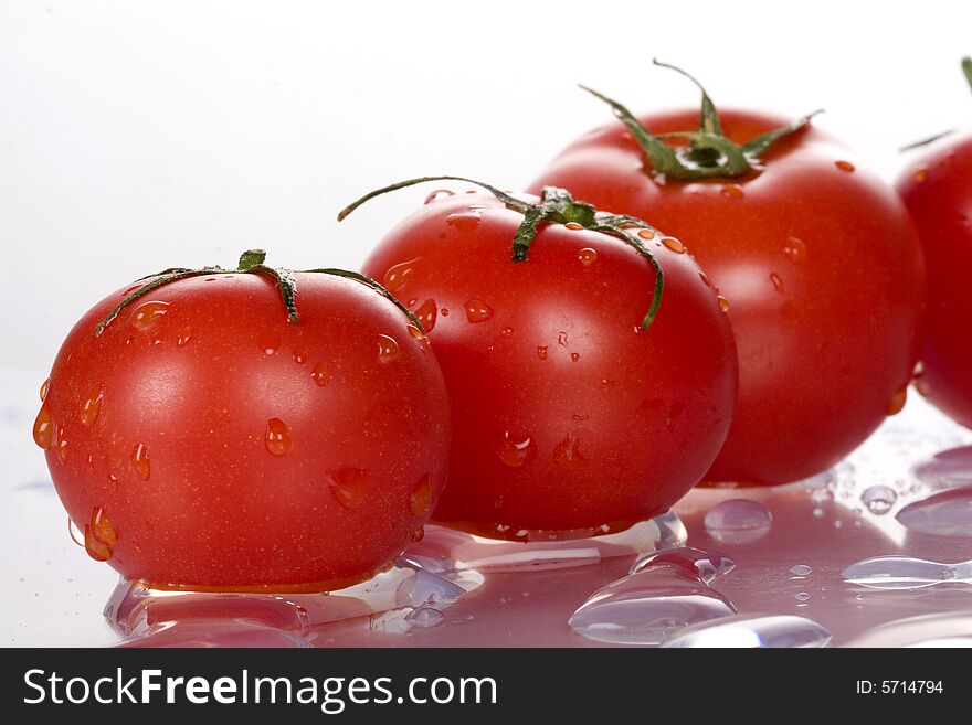 Fresh and nice tomatoes with water droplets.