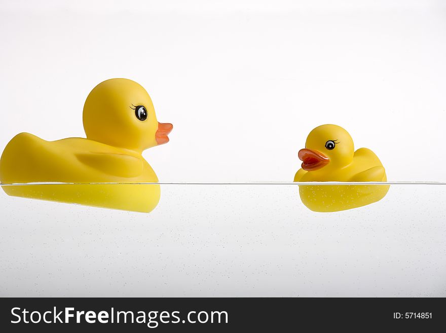 Two yellow rubber duckies, mum and son