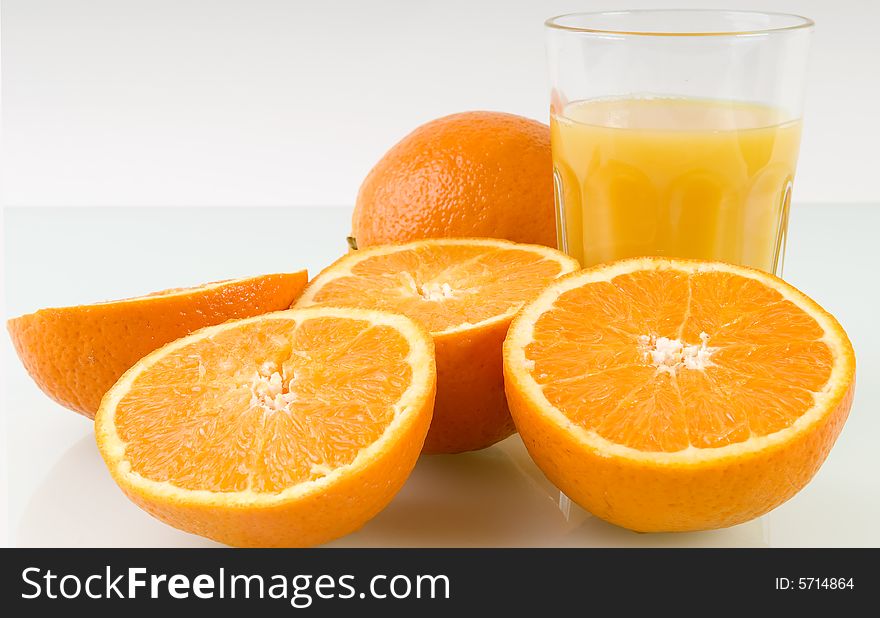 Fresh oranges and glass of orange juice. Fresh oranges and glass of orange juice